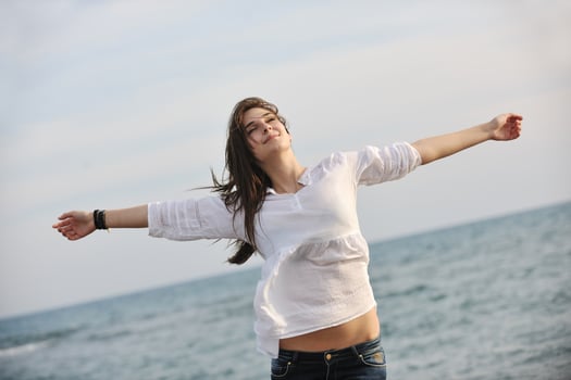 young woman enjoy on beach photo