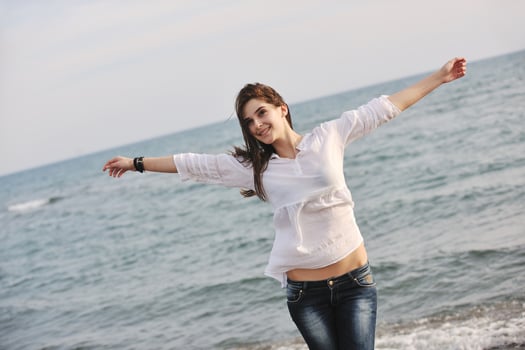 young woman enjoy on beach photo