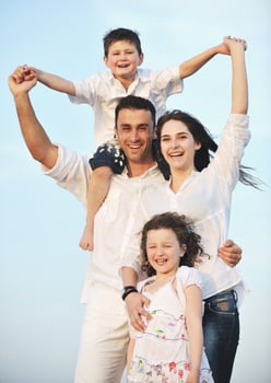 happy young family have fun on beach photo