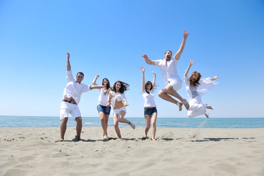 happy young  people group have fun on beach photo