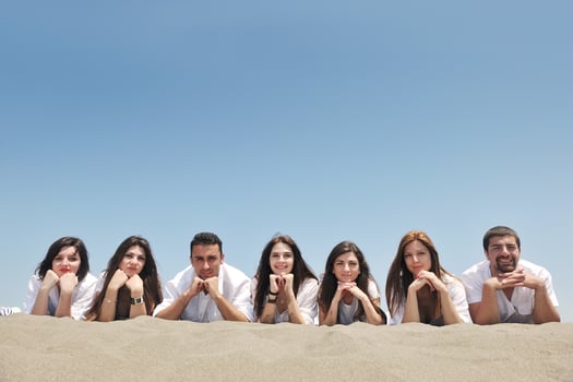 Group of happy young people in have fun at beach photo