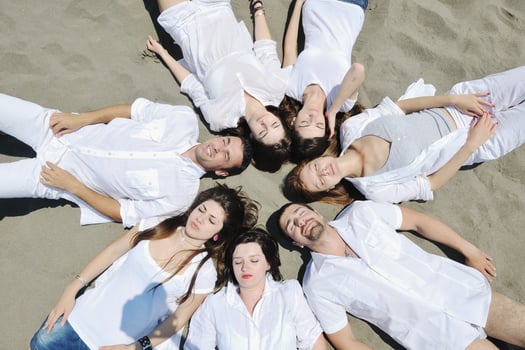 Group of happy young people in have fun at beach photo