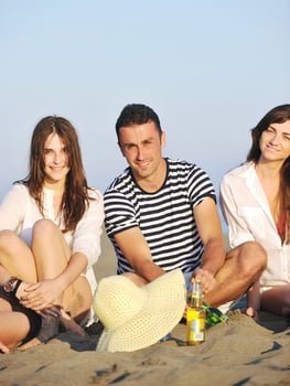 happy young  people group have fun on beach photo