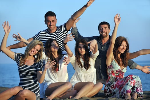 happy young  people group have fun on beach photo