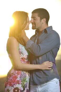 happy young couple have romantic time on beach photo