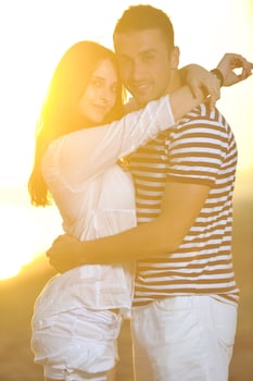 happy young couple have romantic time on beach photo
