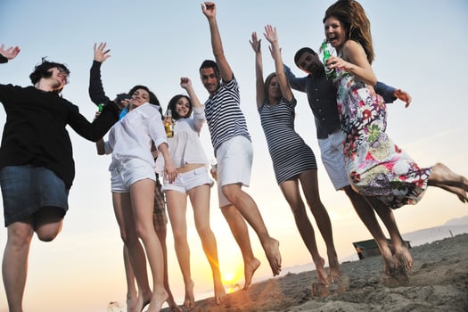 Group of young people enjoy summer  party at the beach photo