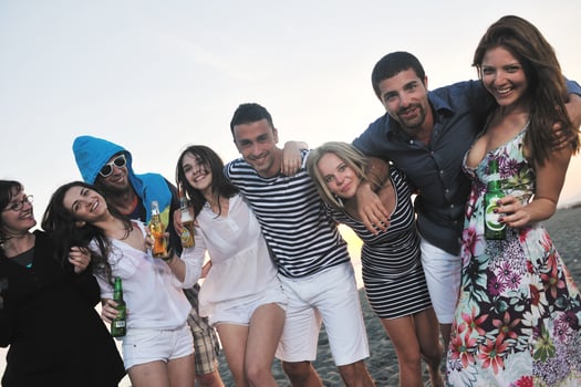 Group of young people enjoy summer  party at the beach photo