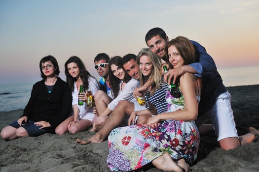 Group of young people enjoy summer  party at the beach photo