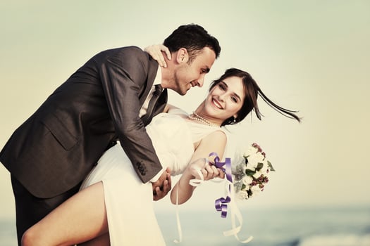 romantic beach wedding at sunset photo