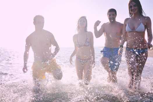 happy people group have fun and running on beach photo