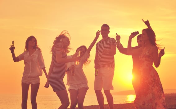 Group of young people enjoy summer  party at the beach photo