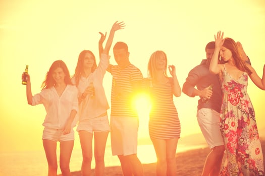 Group of young people enjoy summer  party at the beach photo
