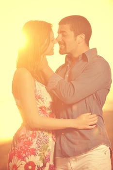 happy young couple have romantic time on beach photo