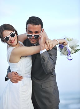 romantic beach wedding at sunset photo