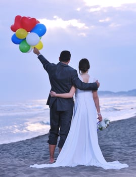 romantic beach wedding at sunset photo