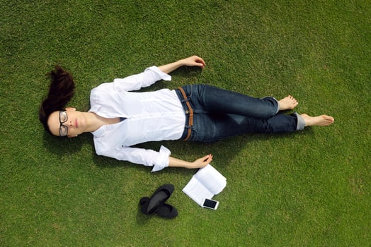Young woman reading a book in the park photo