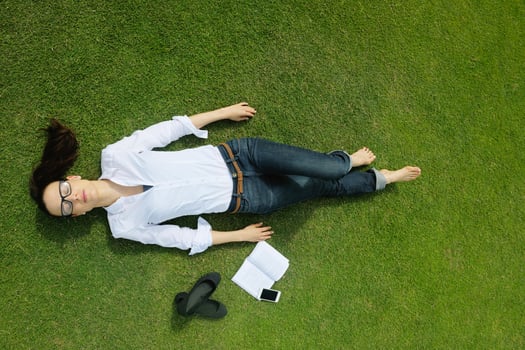 Young woman reading a book in the park photo
