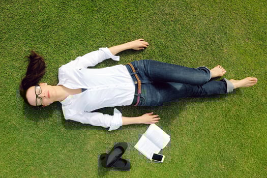 Young woman reading a book in the park photo