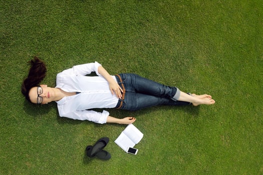 Young woman reading a book in the park photo