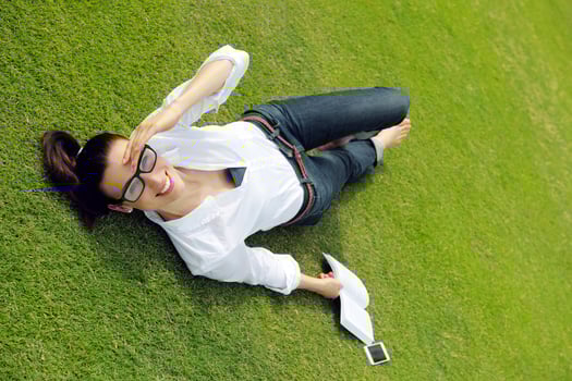Young woman reading a book in the park photo