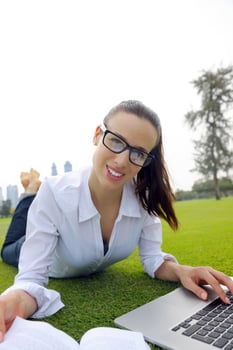 woman with laptop in park photo