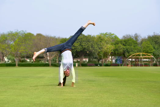 young woman jumping in park photo