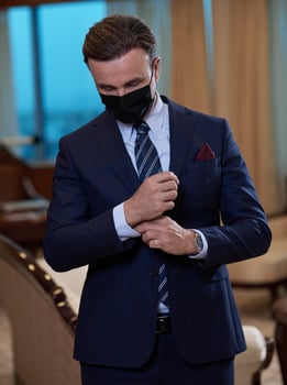 business man wearing protective face mask at office photo