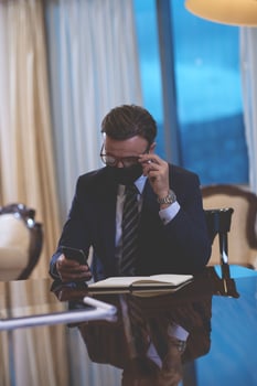 business man wearing protective face mask at office photo