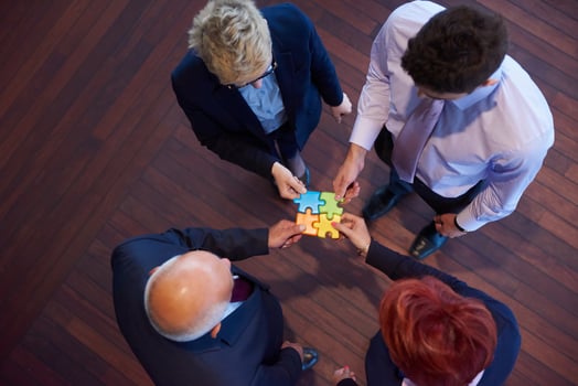 assembling jigsaw puzzle photo