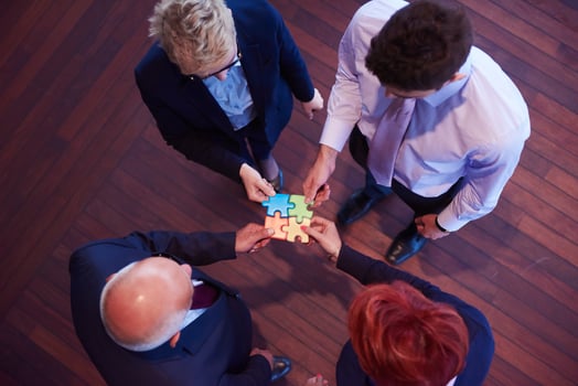 assembling jigsaw puzzle photo