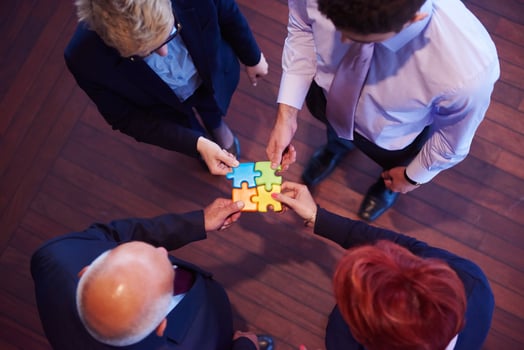 assembling jigsaw puzzle photo