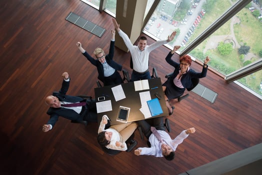 happy business people group on meeting at modern office photo