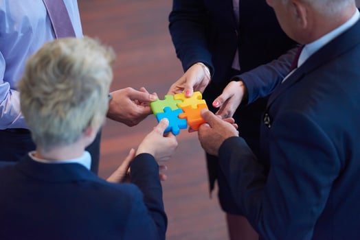 assembling jigsaw puzzle photo