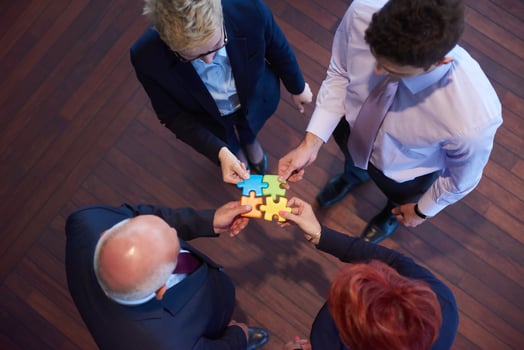 assembling jigsaw puzzle photo