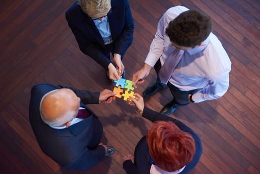 assembling jigsaw puzzle photo
