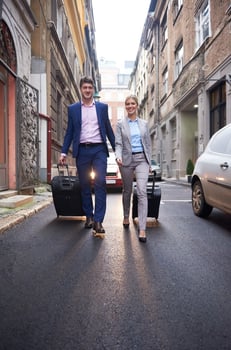business people couple entering  hotel photo