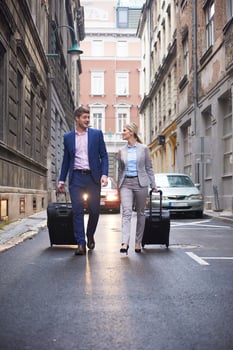 business people couple entering  hotel photo