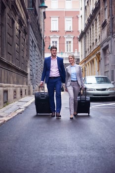 business people couple entering  hotel photo