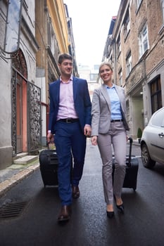 business people couple entering  hotel photo