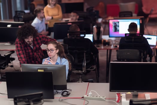 Successful team. Group of young business people working and communicating together in creative office. Selective focus photo