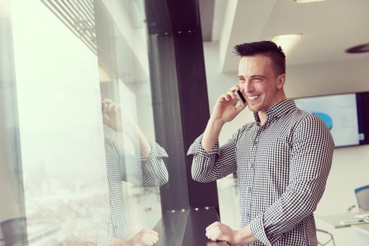 young business man speaking on  smart phone at office photo