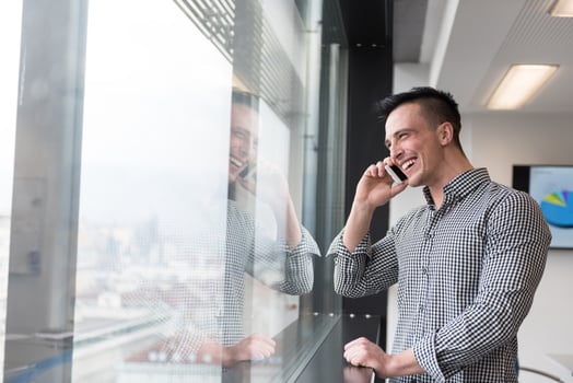 young business man speaking on  smart phone at office photo