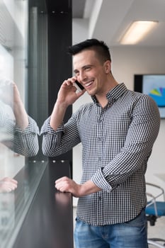 young business man speaking on  smart phone at office photo