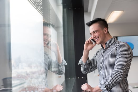 young business man speaking on  smart phone at office photo