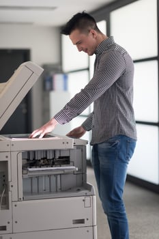 young  business man copy documents photo
