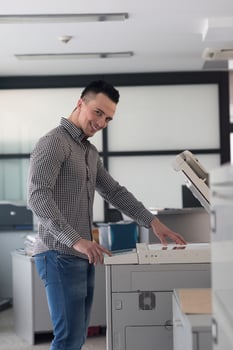 young  business man copy documents photo