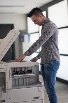 young  business man copy documents photo