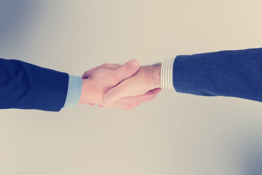 cloasing the deal in modern office interior top view photo