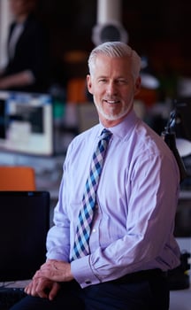 senior business man with his team at office photo